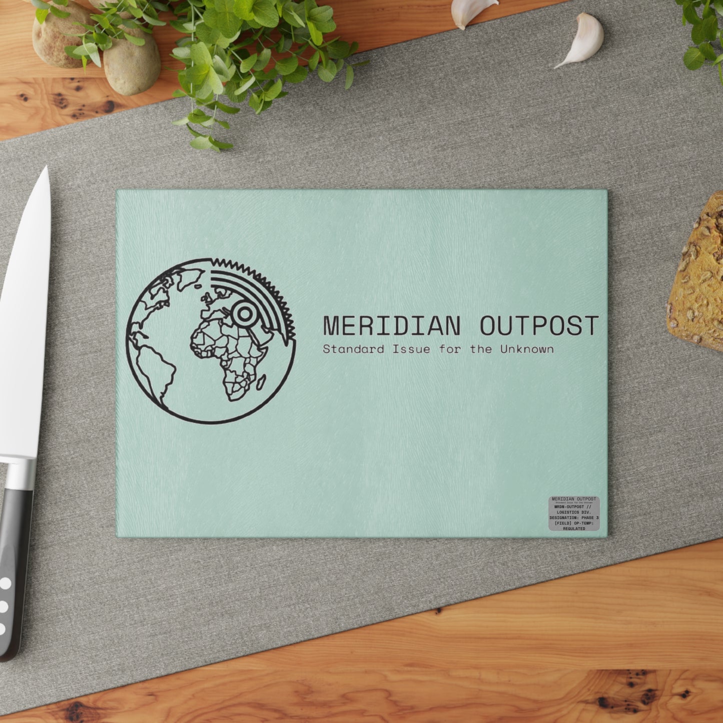 Logistics Division Meridian Outpost Glass Cutting Board — "Standard Issue for the Unknown" Globe Design
